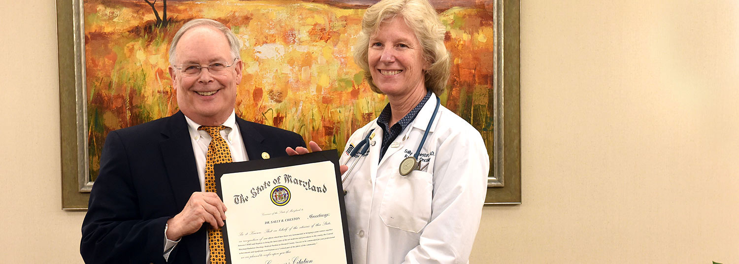 State Health Secretary Robert Neill and Sally B. Cheston, MD