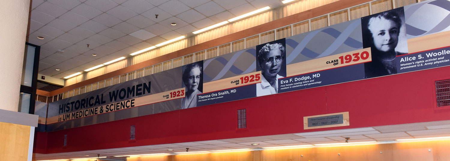 Photo of historical women and men display in the Bressler Research Building lobby