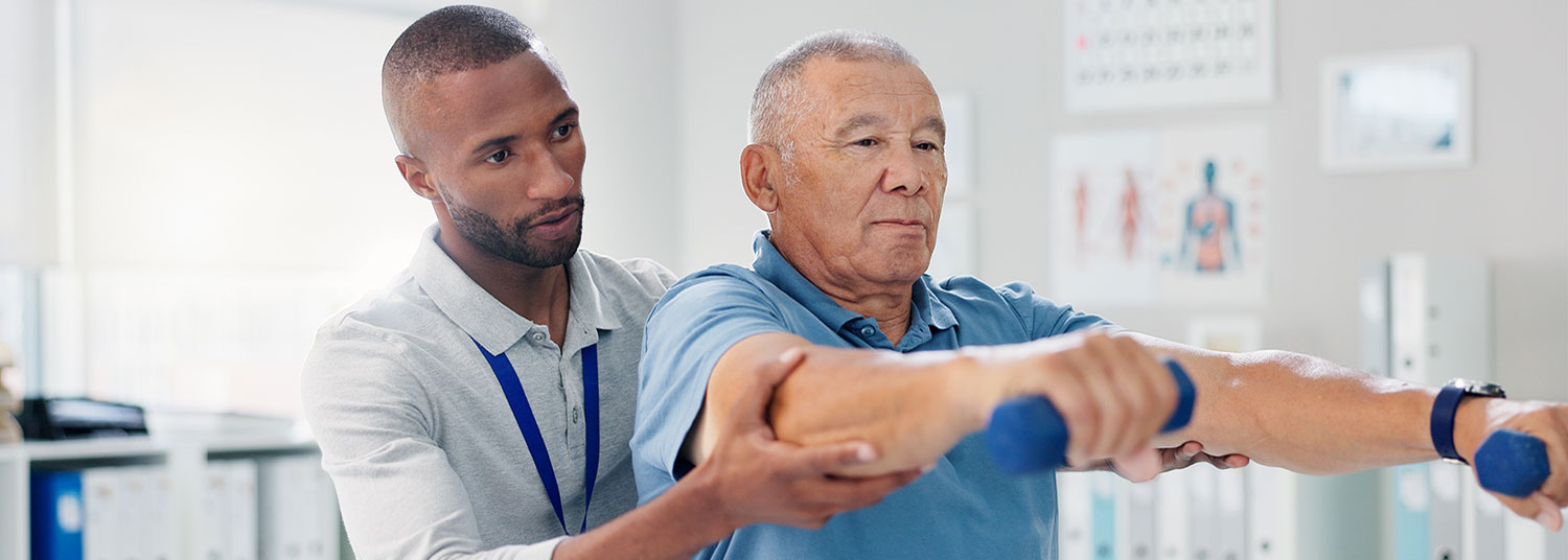 Physical Therapist work with an elderly man