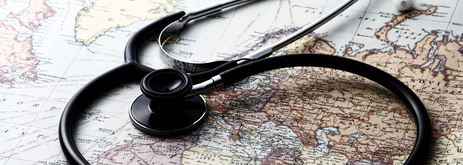 a stethoscope laying on top of a world map