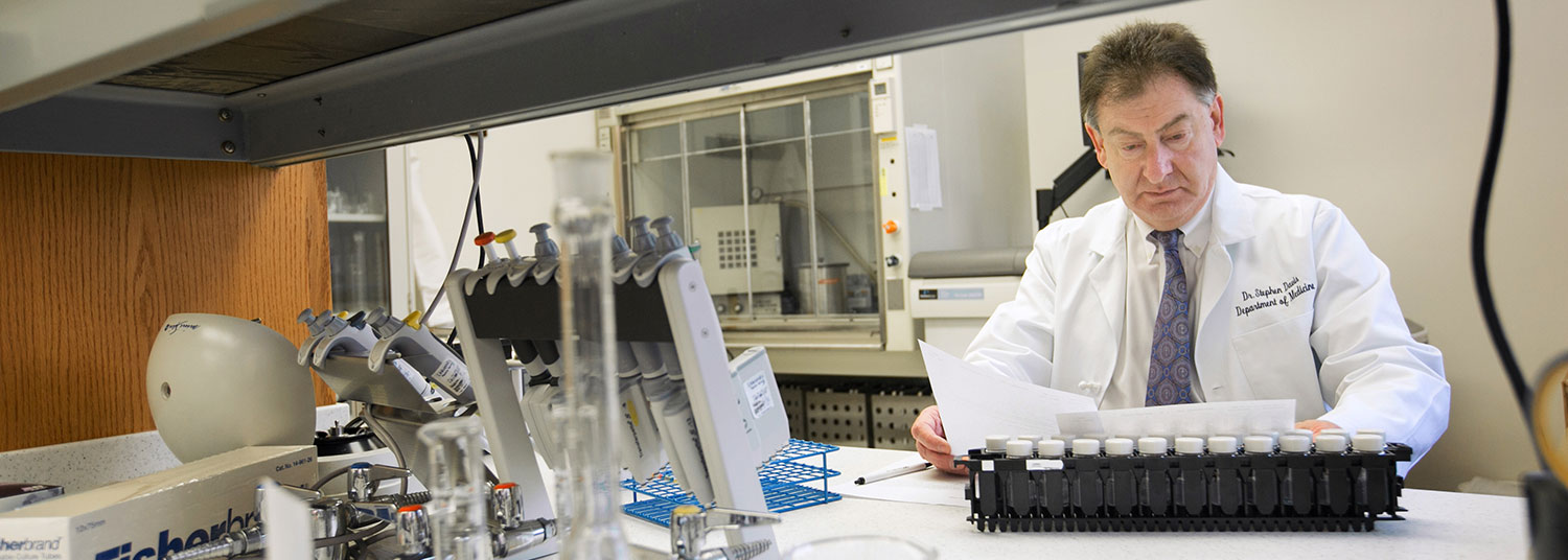 Faculty working in a lab