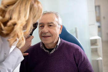 Older gentleman having eyes examined