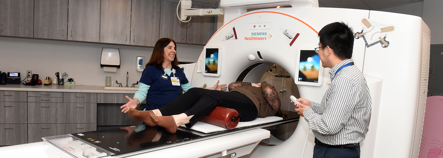 Anesthesiologist with patient having MRI scan