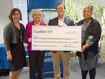 Dr. Weintraub receives check from CareFirst