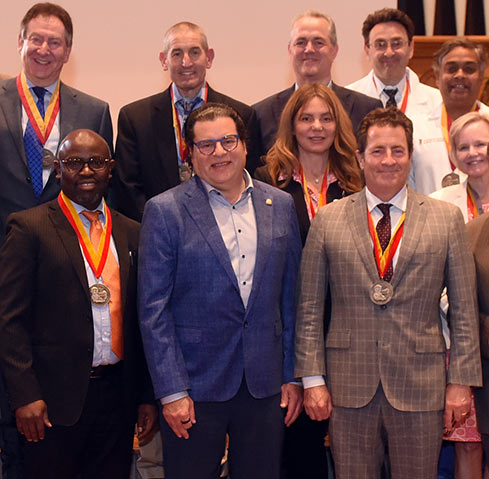 Michael Greenebaum joins Dr. Taofeek Owonikoko, Executive Director of the University of Maryland Marlene and Stewart Greenebaum Comprehensive Cancer Center, and Dean Gladwin at Dr. Owonikoko's recent Investiture Ceremony.